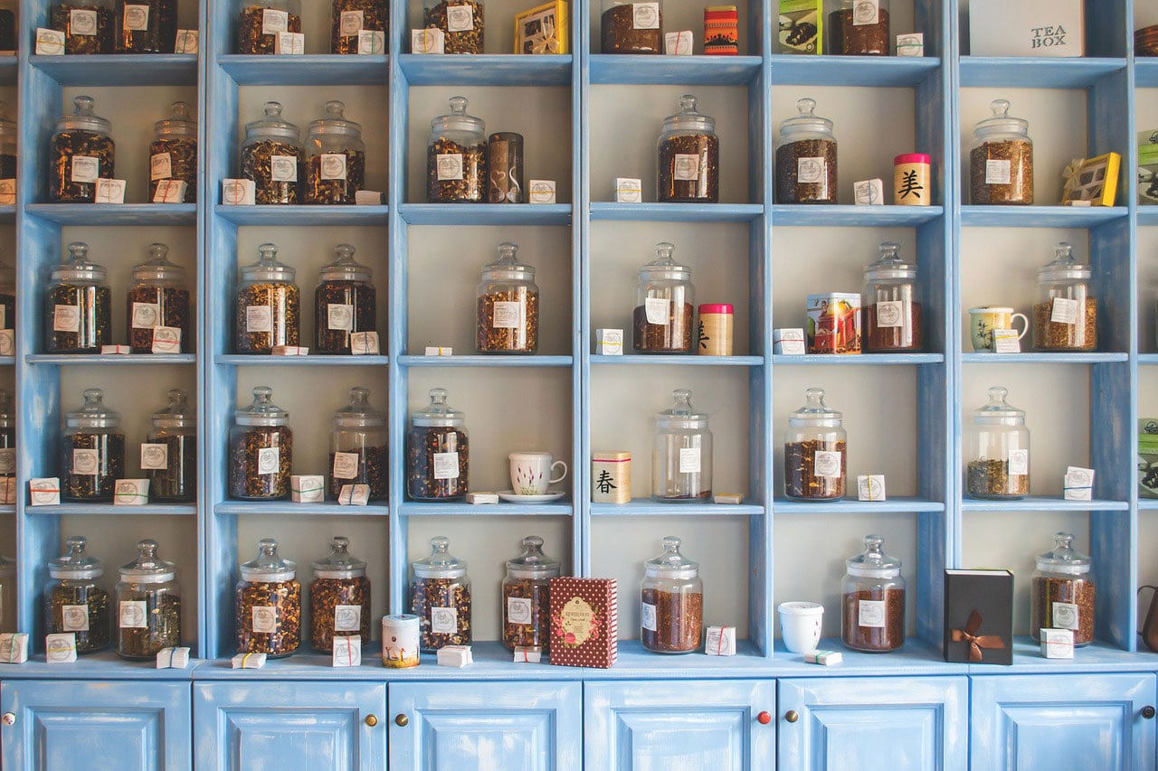 Herbs in jars on shelves